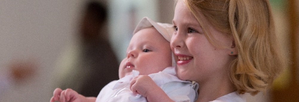 Trinity Lutheran Church - Girl Holding Baby